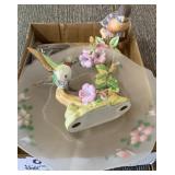 Bird figurines and glass plate