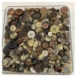 Container of vintage buttons
