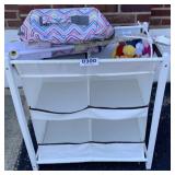 Storage unit, diaper bag, and mobile