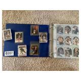 Basketball, baseball and hockey cards in folder