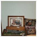 Shelf, picture, pillows and tapestry