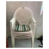 Four plastic lawn chairs