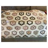 Large antique quilt (wear on the brown)
