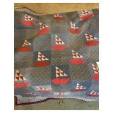 Blue quilt with sailboats