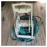 Hose reel (missing wheel) and Garden hoses