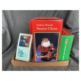 Christmas Santa, bells, and decanter.