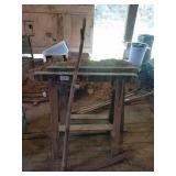 Saw horses and scythe