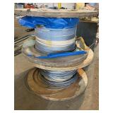 2 wooden spools with cable