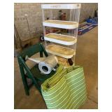 Plastic shelving unit, chair, watering can