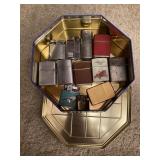 Tin of vintage cigarette lighters