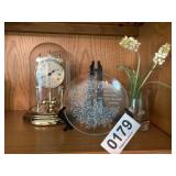 Clock, plate, flowers in vase