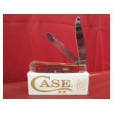 Case XX Dark Red Bone Peach Seed Jig Trapper