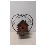 Hanging bird house in wrought iron hanger
