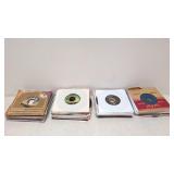 100 vintage 45 RPM records in sleeves