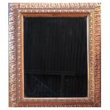 ornate framed beveled mirror