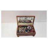 Vintage carved jewelry box full of costume jewelry