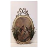 Birds painted on metal with applied metal flowers