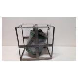 Vintage oil can in metal cage