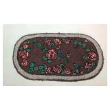 Antique oval hand hooked rug
