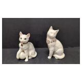 Two Lenox white cats