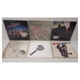 (6) Rock albums in plastic sleeves