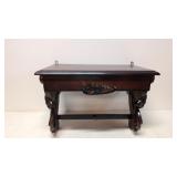 Ornate mahogany wall shelf with drawer