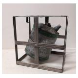 Vintage galvanized oil can in cage