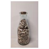 Large Embossed milk bottle ful of wine corks