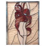 Leaded glass window of nude lady