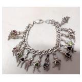 Heavy sterling charm bracelet with 15 Kid charms