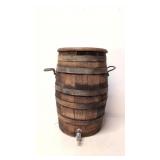 Antique wooden water barrel with spout