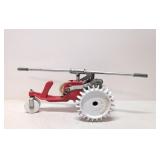 Vintage Thompson Tractor crawling water sprinkler