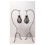Two Wrought iron outdoor pineapple candle holders