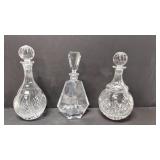 Three heavy crystal decanters