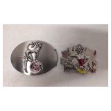 Two large belt buckles