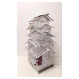 White oriental bird cage with faux red birds