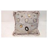 12 Cameo pins on lace pillow