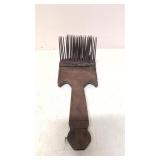 Primitive carding comb