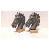 two Ceramic Horse heads on wood base