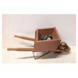 Small wooden wheelbarrow with marbles