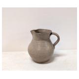 Small hand thrown pottery pitcher