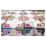 Hand pieced and quilted log cabin quilt