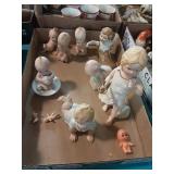 Figural baby statues