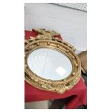 Big gold colored vintage mirror