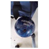 Purple and blue bowling balls in case