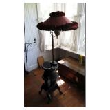 Pot belly stove with lamp built into it