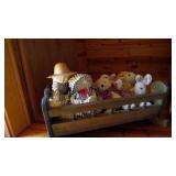 Small cradle and stuffed animals