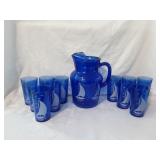 Blue glass sailboat glasses and pitcher