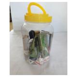 Jug of little pocket knives