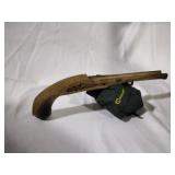 Handcarved wood pistal